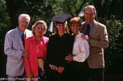 A graduate with family; Actual size=240 pixels wide
